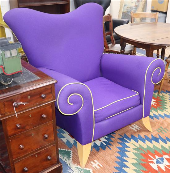 A contemporary mauve fabric armchair W.106cm